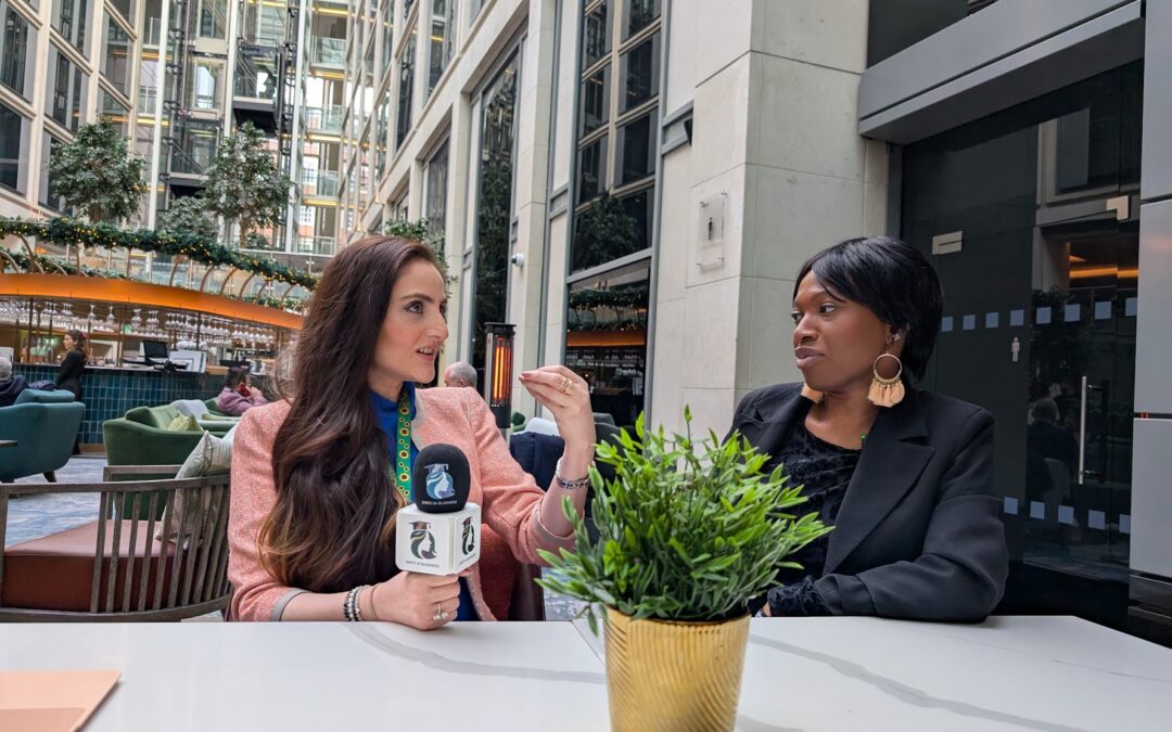 Two She’s In Business women business owners holding a She’s In Business microphone, representing confident leadership, peer support, and women-led entrepreneurship within the accelerator community.