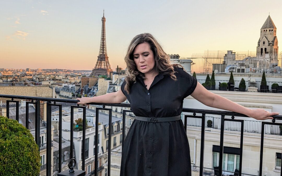 Dr Stephanie Wilson on a Paris rooftop with the Eiffel Tower at sunset — founder of Expert to CEO and women's business strategist