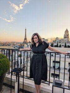 Dr Stephanie Wilson on a Paris rooftop with the Eiffel Tower at sunset — founder of Expert to CEO and women's business strategist